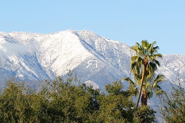 A letter R is formed into a mountainside